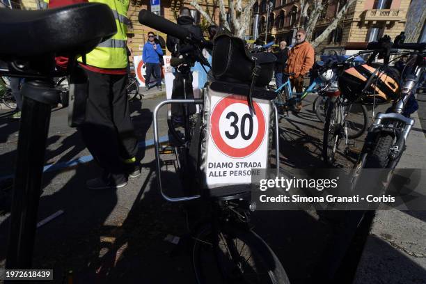 People with banners and placards on bicycles with the words: let's give people a way, protest for a new highway code that introduces the ban on...