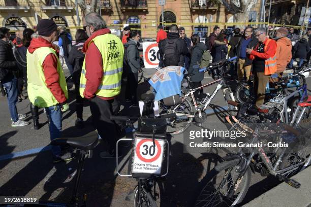 People with banners and placards on bicycles with the words: let's give people a way, protest for a new highway code that introduces the ban on...