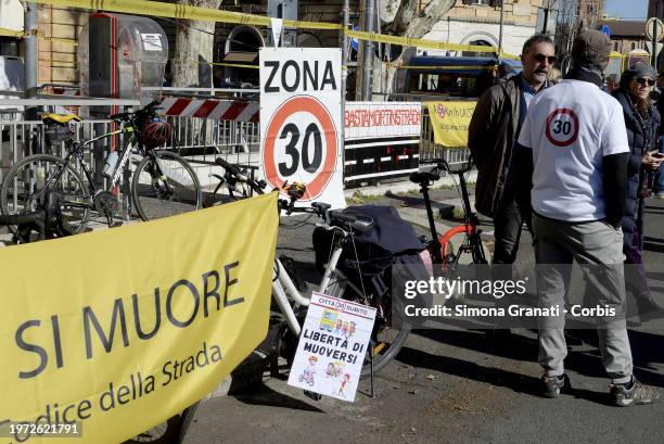 People with banners and placards protest for a new highway code that introduces the ban on exceeding 30 km per hour in the city, on February 2, 2024...