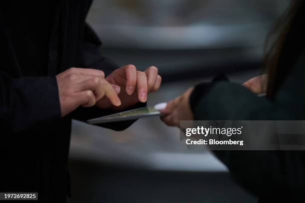 Customer checks in on an iPad outside Apple's Fifth Avenue store in New York, US, on Friday, Feb. 2, 2024. Apple Inc.'s first major new product in...