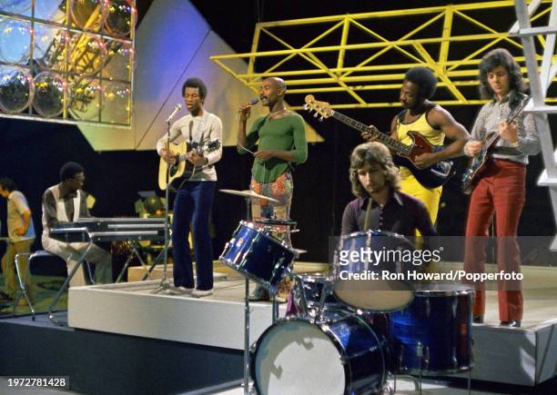 British soul group Hot Chocolate perform on the set of a pop music television show in London in September 1971. Members of the group are, from left,...