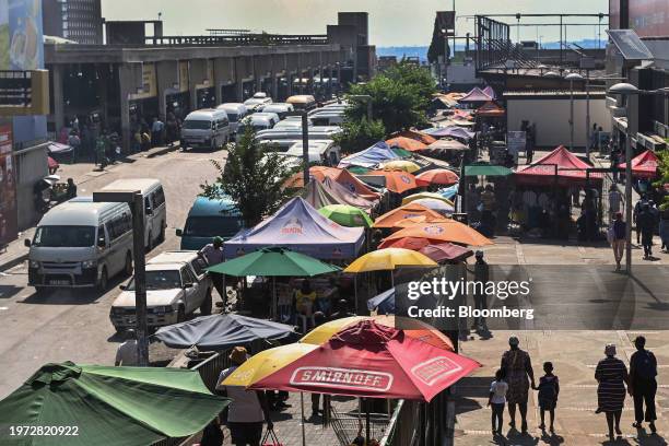 Umbrellas cover informal market stalls by Bara taxi rank in the Soweto district of Johannesburg, South Africa, on Thursday, Feb. 1, 2024. South...