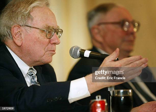 Berkshire Hathaway's CEO Warren Buffett and his business partner Vice Chairman Charles Munger answer questions at a news conference May 4, 2003 in...