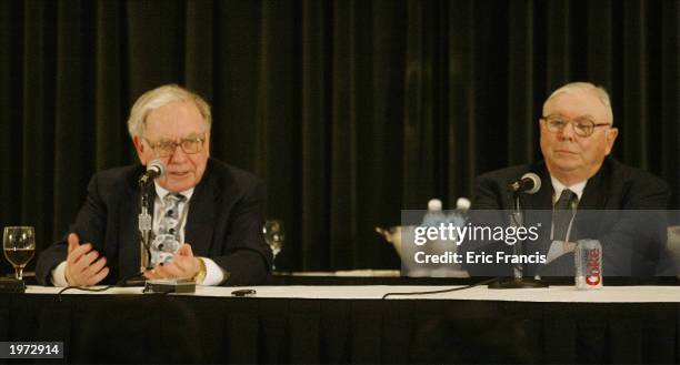 Berkshire Hathaway's CEO Warren Buffett and his business partner Vice Chairman Charles Munger answer questions at a news conference May 4, 2003 in...