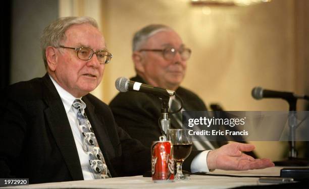 Berkshire Hathaway's CEO Warren Buffett and his business partner Vice Chairman Charles Munger answer questions at a news conference May 4, 2003 in...