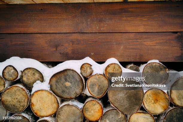 wood pile firewood background - buening shack stock pictures, royalty-free photos & images