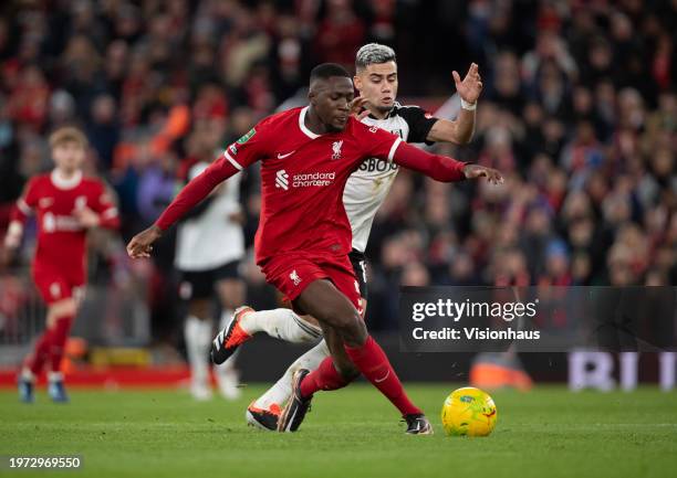 Ibrahima Konate of Liverpool and Andreas Pereira of Fulham in action during the Carabao Cup Semi Final First Leg match between Liverpool and Fulham...