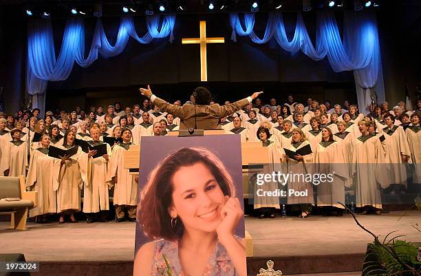 Choir sings during the memorial service for Laci Peterson and her unborn son Conner May 4, 2003 in Modesto, California. About 3,000 people gathered...