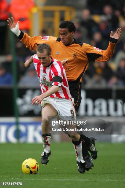 November 26: Brett Ormerod of Southampton and Tom Huddleston of Wolverhampton Wanderers challenge during the match between Wolverhampton Wanderers...