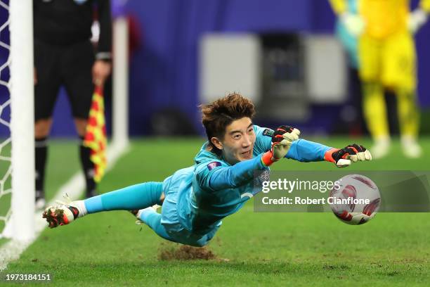 Jo Hyeon-Woo of South Korea saves in the penalty shootout during the AFC Asian Cup Round of 16 match between Saudi Arabia and South Korea at...