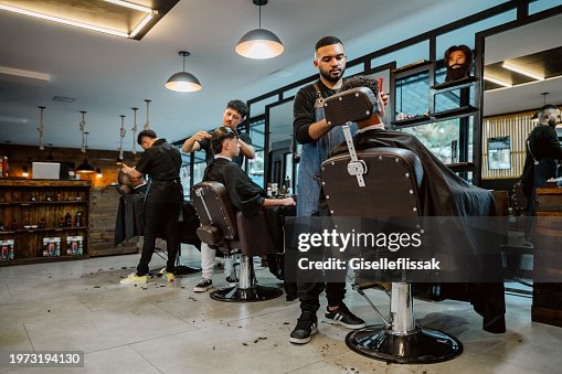 Professional hairdressers serving clients in salon Professional hairdressers serving clients in salon