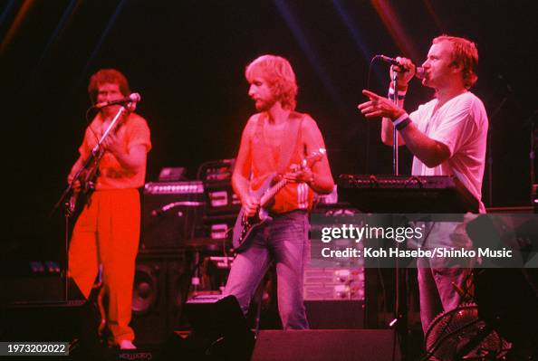 Genesis on stage in circa 1982. Daryl Stuemmer, Mike Rutherford, Phil ...