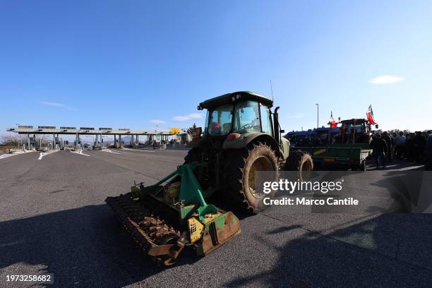 Farmers on their tractors, in front of the highway entrance, block traffic during the demonstration to protest against the "Green Deal" initiatives,...