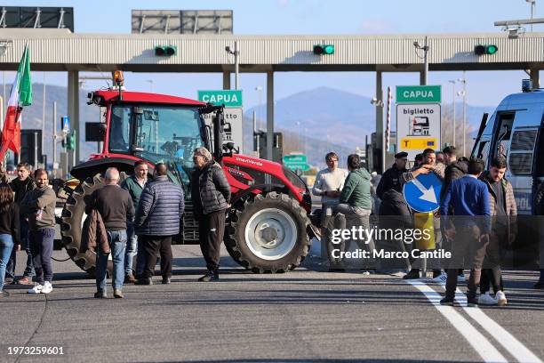 Farmers on their tractors, in front of the highway entrance, block traffic during the demonstration to protest against the "Green Deal" initiatives,...