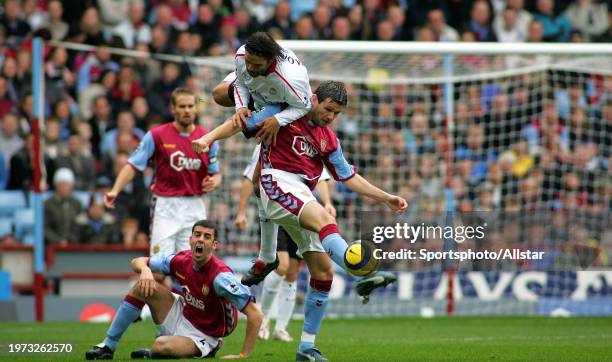 November 5: Eirik Bakke of Aston Villa and Momo Sissoko of Liverpool challenge during the Premier League match between Aston Villa and Liverpool at...