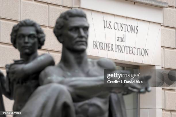 The front entrance to the US Customs and Border Protection headquarters building is framed by a statue named Reason on January 30 in Washington, DC....