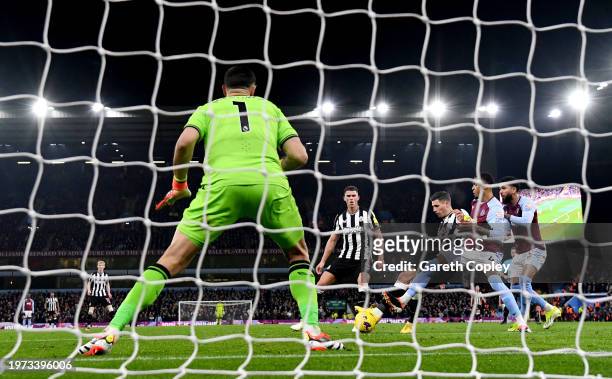 Fabian Schaer of Newcastle United scores his team's first goal past Emiliano Martinez of Aston Villa during the Premier League match between Aston...