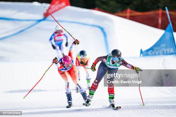 Saskja Lack of Switzerland and India Sherret of Canada in the finish during the FIS Freestyle World Cup Men's and Women's Ski Cross Finals on...