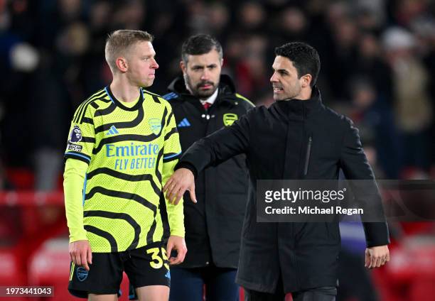 Oleksandr Zinchenko of Arsenal and Mikel Arteta, Manager of Arsenal, interact after the team's victory in the Premier League match between Nottingham...