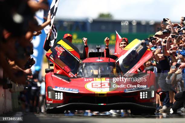 The No.51 Ferrari AF Corse Ferrari 499P of Alessandro Pier Guidi, James Calado and Antonio Giovinazzi drives down the pit lane to celebrate after...