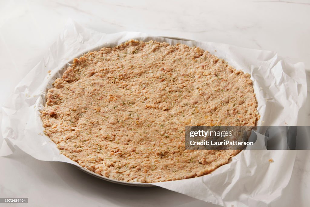Preparing Bacon Ranch Chicken Crust Pizza