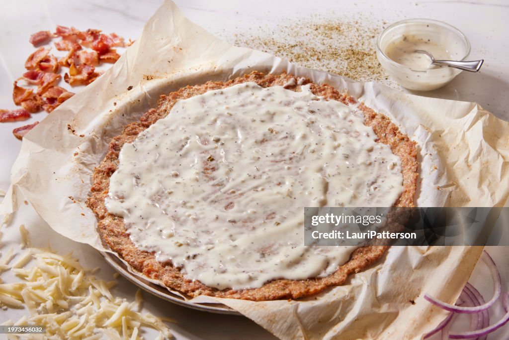 Preparing Bacon Ranch Chicken Crust Pizza