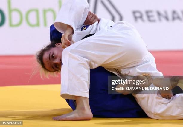 Kosovo's Distria Krasniqi competes against Great Britain's Chelsie Giles on her way to win in the women's -52 kg final of the Paris Grand Slam on...