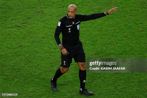 Omani referee Ahmed al-Kaf points during the Qatar 2023 AFC Asian Cup quarter-final football match between Australia and South Korea at Al-Janoub...