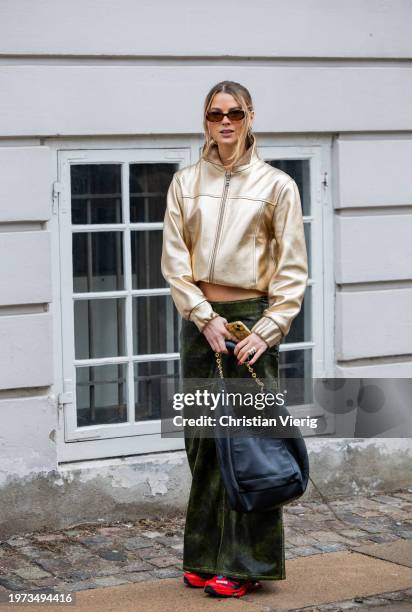 Anna Winck wears green laced skirt, metallic golden jacket outside Lovechild 1979 during the Copenhagen Fashion Week AW24 on January 30, 2024 in...