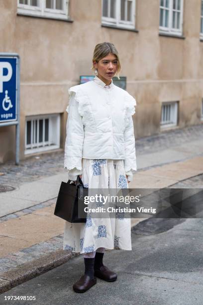Ines Isaias wears white top, skirt outside Lovechild 1979 during the Copenhagen Fashion Week AW24 on January 30, 2024 in Copenhagen, Denmark.