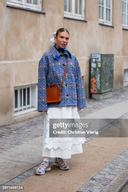 Rita Montezuma wears brown bag, purple jacket outside Lovechild 1979 during the Copenhagen Fashion Week AW24 on January 30, 2024 in Copenhagen,...