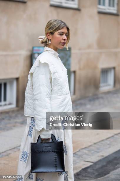 Ines Isaias wears white top, skirt outside Lovechild 1979 during the Copenhagen Fashion Week AW24 on January 30, 2024 in Copenhagen, Denmark.