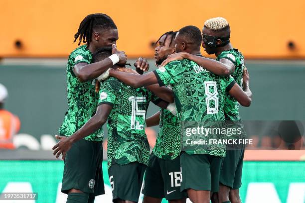 Nigeria's forward Ademola Lookman celebrates scoring his team's first goal with teammates during the Africa Cup of Nations 2024 quarter-final...