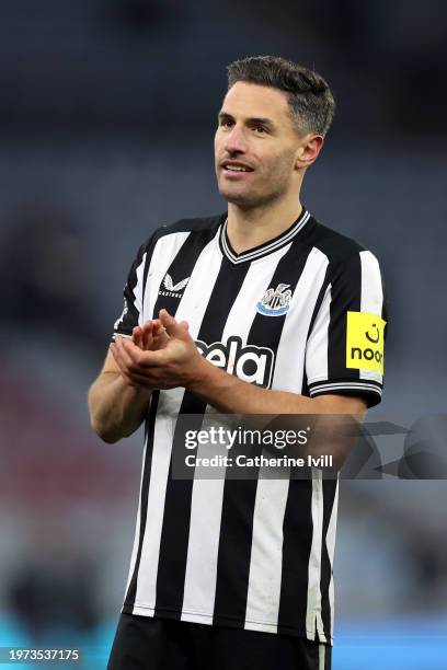 Fabian Schaer of Newcastle United applauds the fans at full-time following the teams victory in the Premier League match between Aston Villa and...