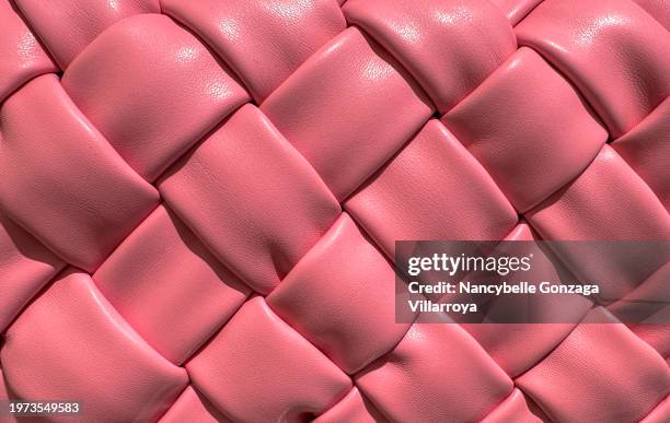 pink textured faux leather material - synthetic-leather stock pictures, royalty-free photos & images