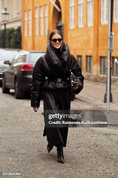 Nina Sandbech wears a black leather skirt and black leather jacket with a belt outside LOvechild 1979 during the Copenhagen Fashion Week AW24 on...