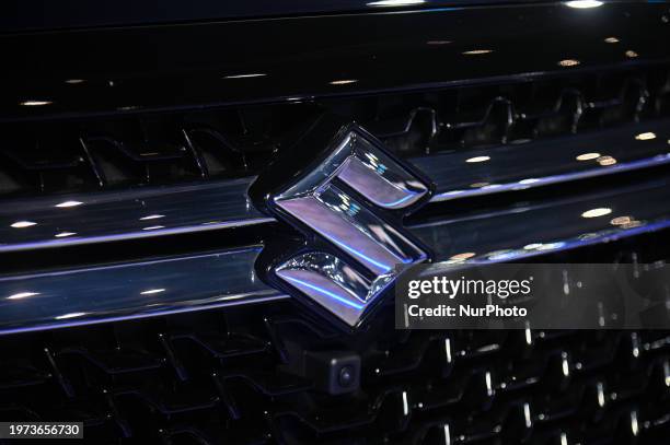 The Suzuki logo is visible on its hybrid car, the Maruti Suzuki Invicto, at the Bharat Mobility Global Expo 2024 in New Delhi, India, on February 2,...