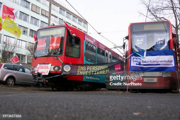 Several strike signs are being displayed on streetcars at the Cologne transit depot in Cologne, Germany, on February 2 as public transportation...