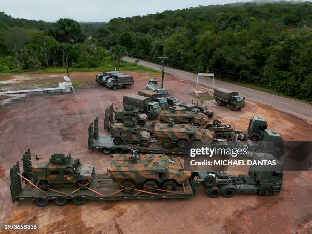 Brazilian Army vehicles are seen parked at a point on BR-174 between Manaus and Boa Vista during the deployment to the state of Roraima to reinforce...