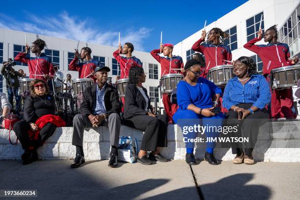 Supporters of US President Joe Biden listen as members of the South Carolina State University marching band perform ahead of Vice President Kamala...