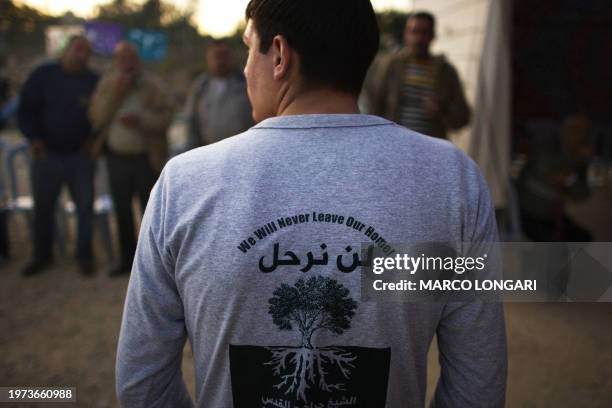 Palestinians stand outside the mourning tent of late Mohamed al-Kurd on November 24, 2008 in an east Jerusalem neighborhood from where the...