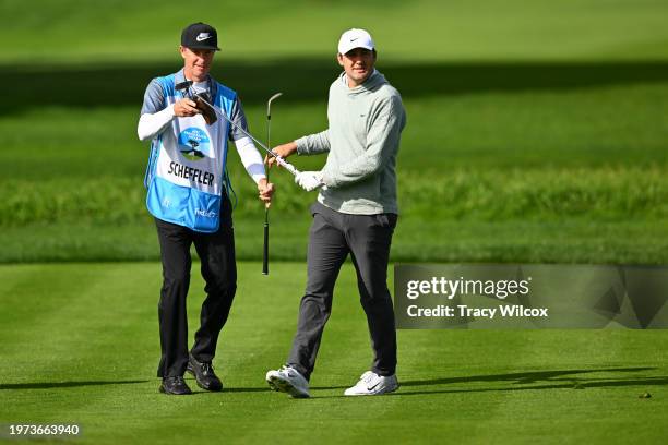 Scottie Scheffler with his caddie, Ted Scott, on the second hole during the second round of AT&T Pebble Beach Pro-Am at Pebble Beach Golf Links on...