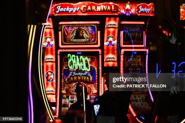 Customers use slot machines inside a casino ahead of a strike deadline for the Culinary Workers and Bartenders Unions contract before the Super Bowl...