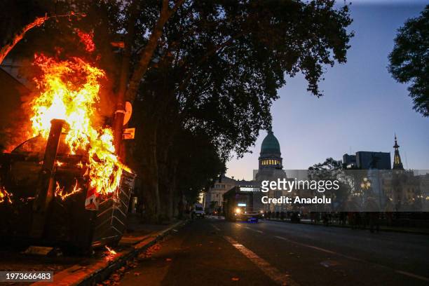 View of the rubbish bin burned by demonstrators in protest during the national congress of Argentina where the 'Omnibus Law' promoted by Javier...