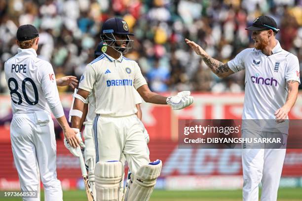 India's Yashasvi Jaiswal is congratulated by England's captain Ben Stokes after his dismissal for scoring 209 runs during the second day of the...