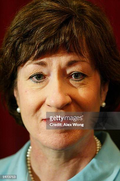 Senator Susan Collins listens to questions from reporters after attending a media conference releasing McCarthy era records May 5, 2003 on Capitol...
