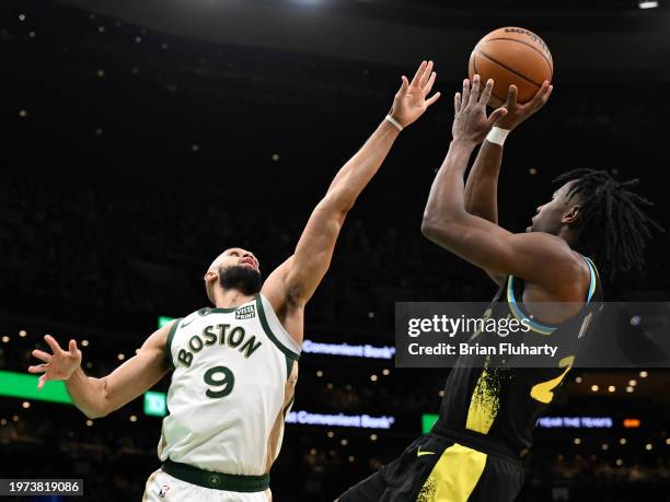 Aaron Nesmith of the Indiana Pacers shoots against Derrick White of the Boston Celtics during the first quarter at the TD Garden on January 30, 2024...