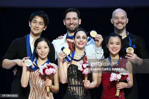 Canada's Deanna Stellato-Dudek and Maxime Deschamps celebrate after winning the pairs competition at the ISU Four Continents Figure Skating...