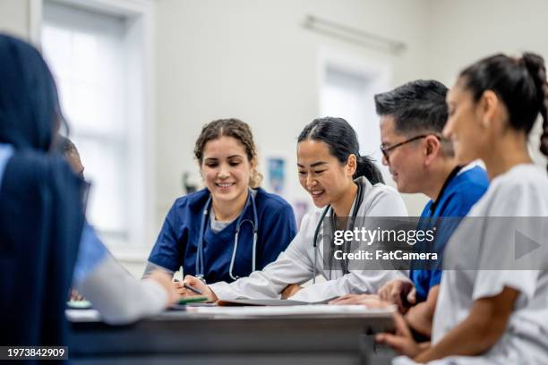 working together - medical school stock pictures, royalty-free photos & images