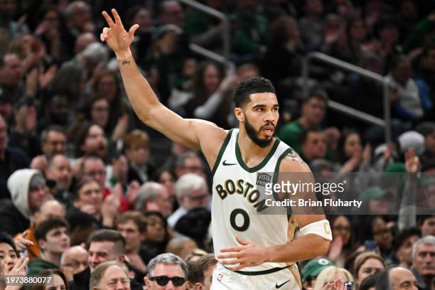 Jayson Tatum of the Boston Celtics reacts after scoring a three-point basket against the Indiana Pacers during the second quarter at the TD Garden on...
